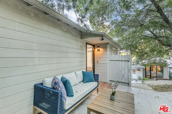 a view of a patio in the backyard