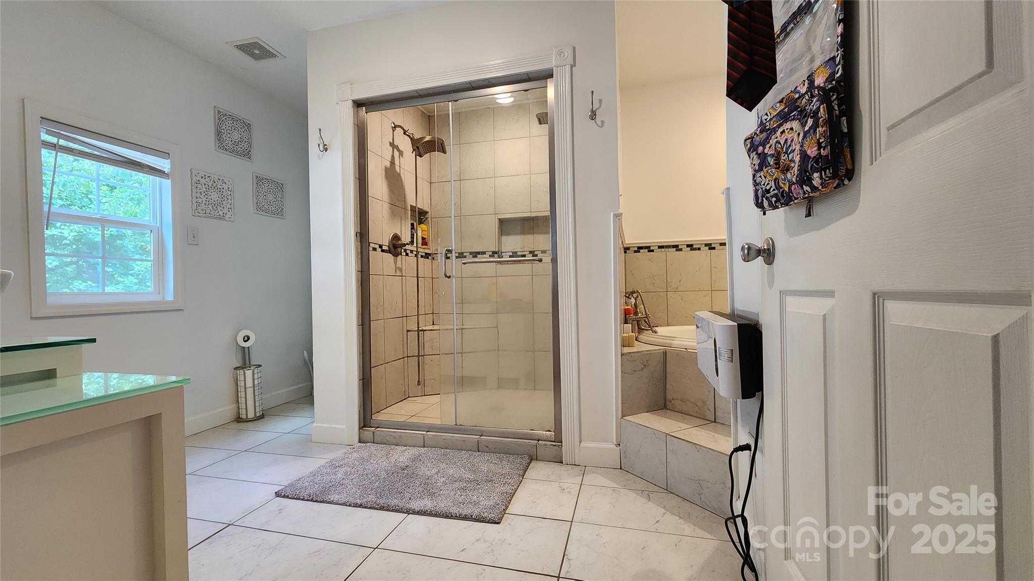 1235 Sulphur Springs Road Waynesville, NC 28786 - Photo 13 of 40 a bathroom with a shower and a toilet