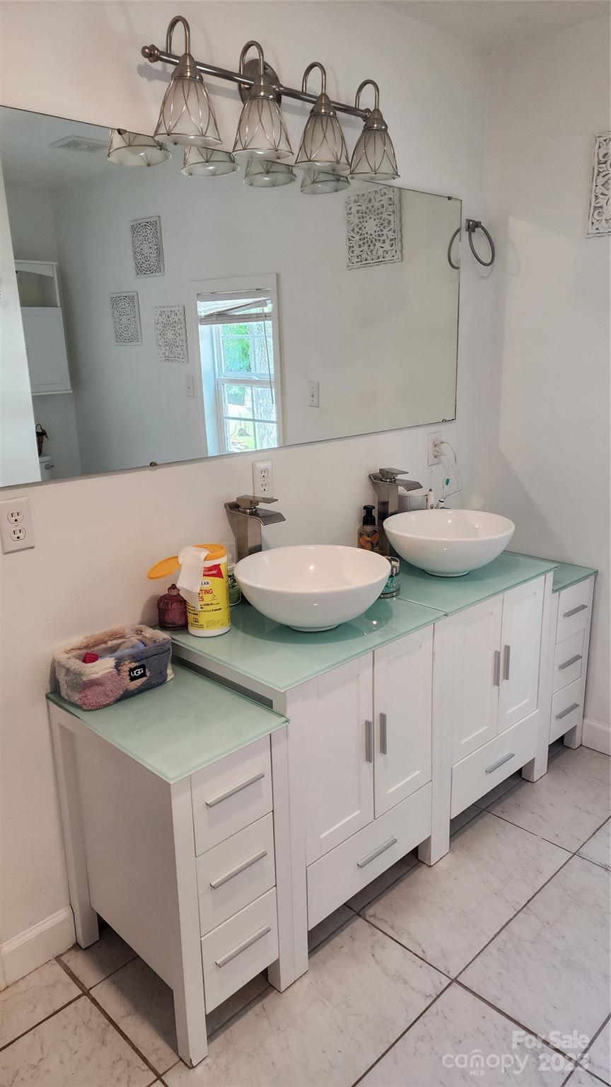 1235 Sulphur Springs Road Waynesville, NC 28786 - Photo 14 of 40 a bathroom with a sink and a mirror