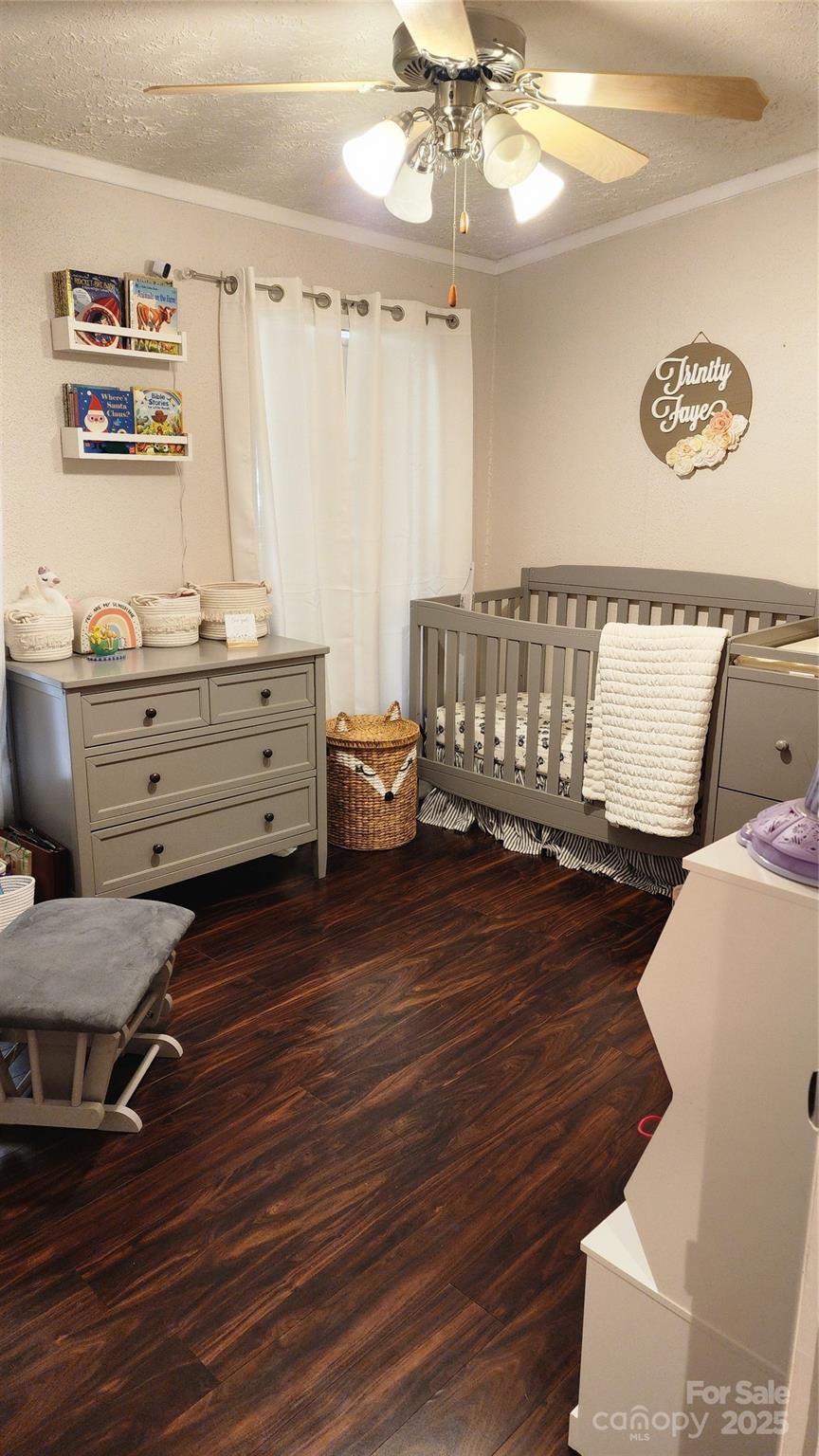 1235 Sulphur Springs Road Waynesville, NC 28786 - Photo 16 of 40 a bed room with a bed and a chair