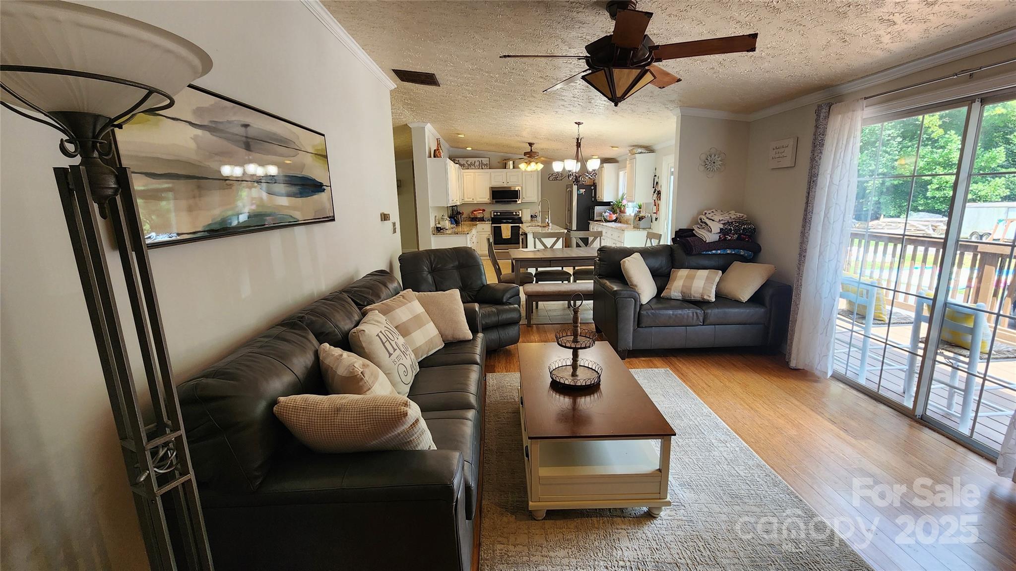 1235 Sulphur Springs Road Waynesville, NC 28786 - Photo 24 of 40 a living room with furniture and a flat screen tv