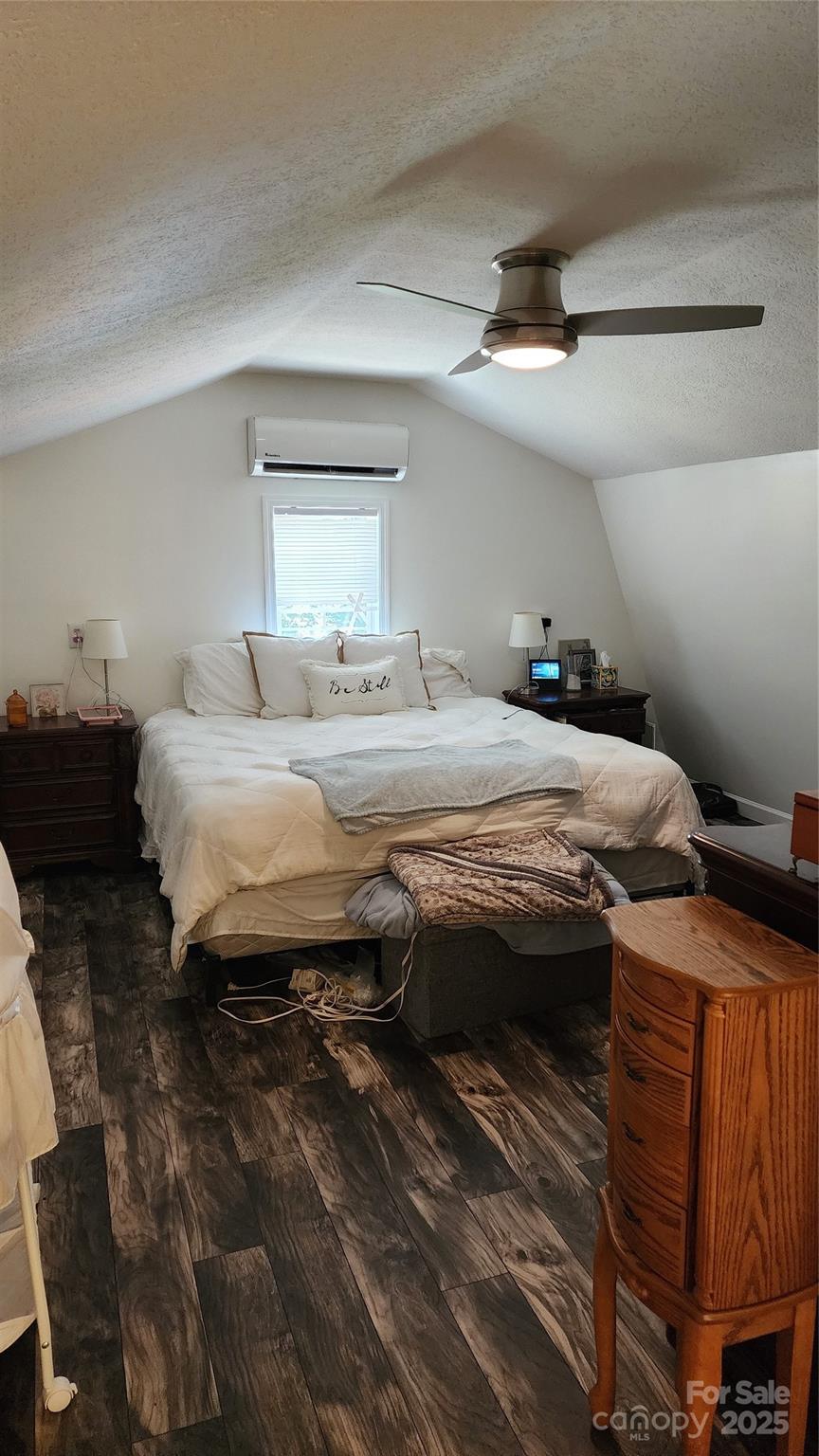 1235 Sulphur Springs Road Waynesville, NC 28786 - Photo 25 of 40 a bedroom with a bed and a dresser