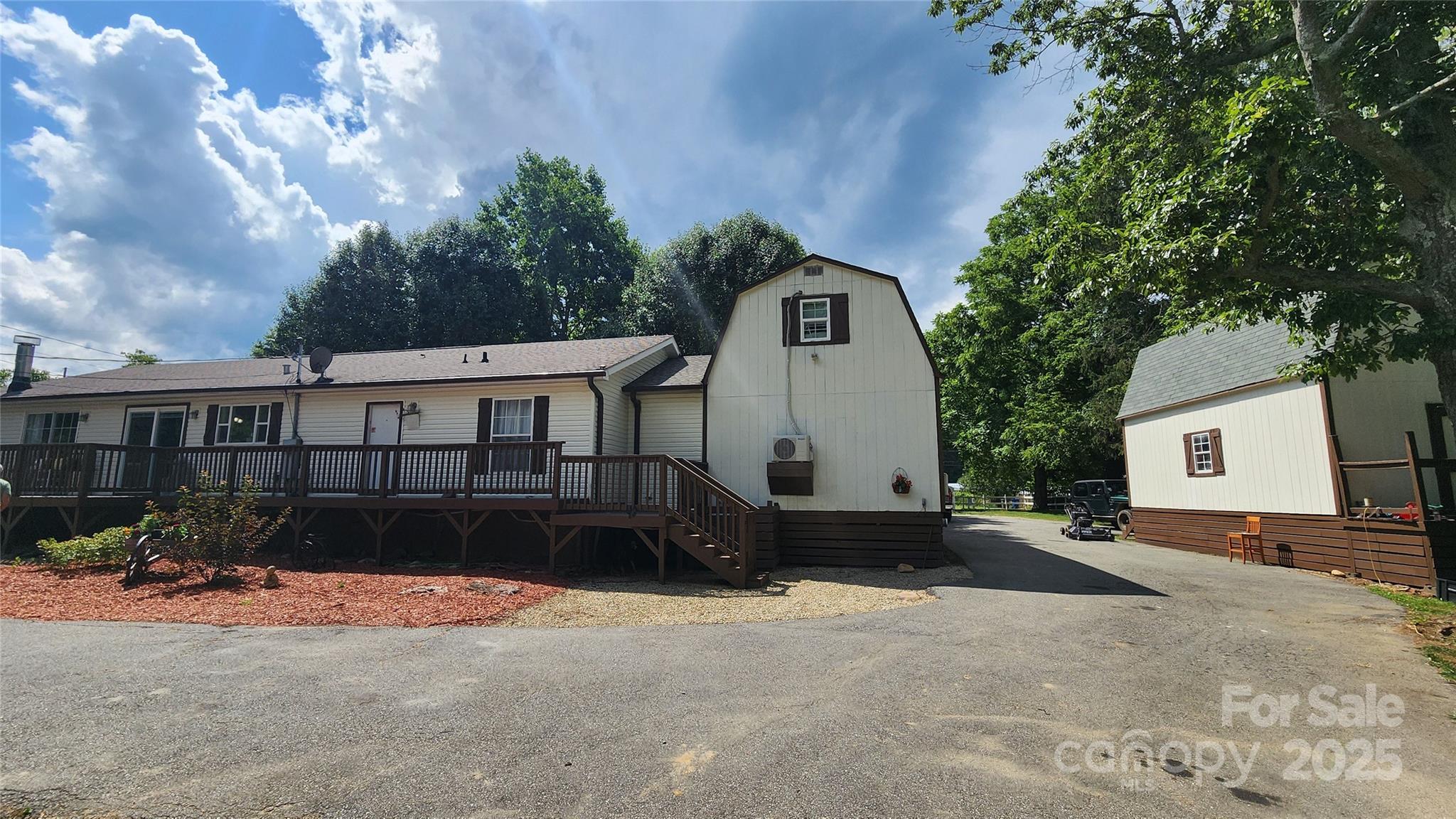 1235 Sulphur Springs Road Waynesville, NC 28786 - Photo 29 of 40 a front view of a house with a yard