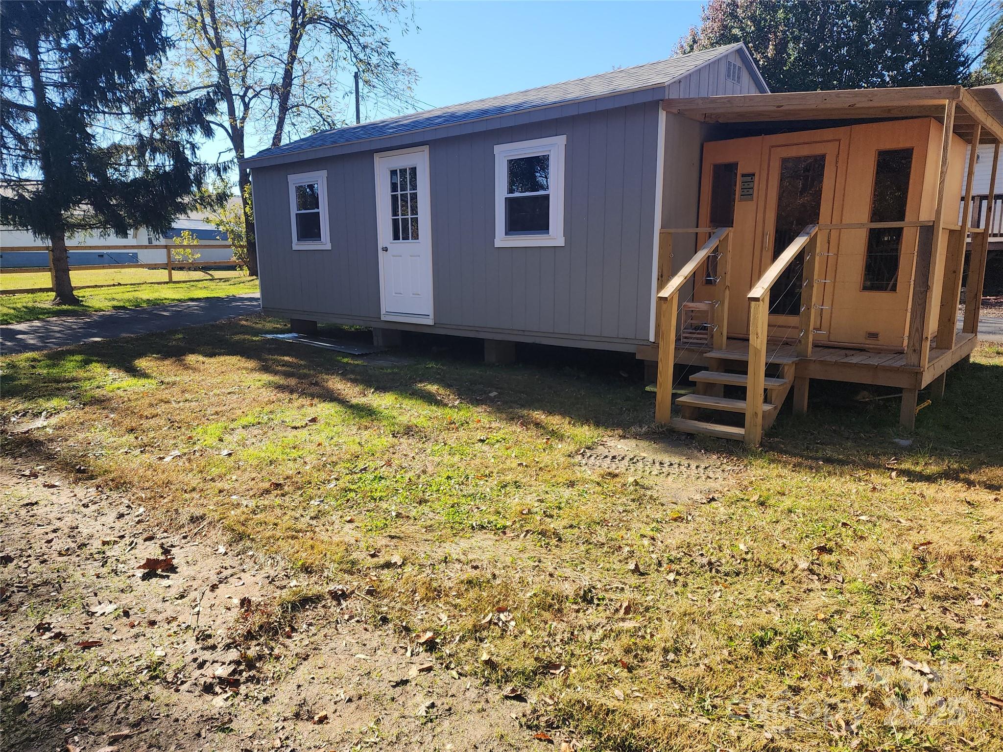 1235 Sulphur Springs Road Waynesville, NC 28786 - Photo 30 of 40 a view of a house with backyard and trees