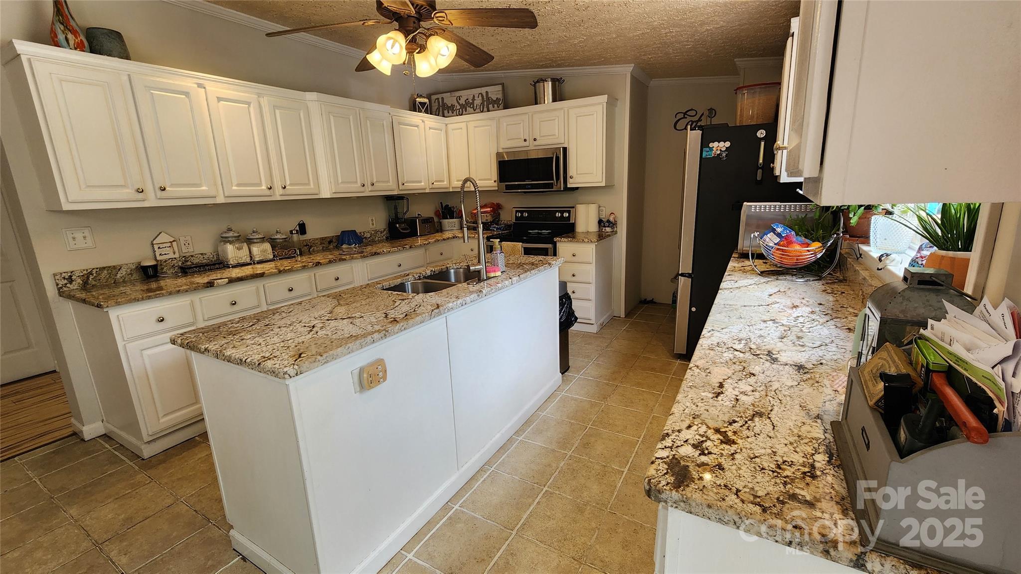 1235 Sulphur Springs Road Waynesville, NC 28786 - Photo 8 of 40 a kitchen with granite countertop a sink stove and cabinets
