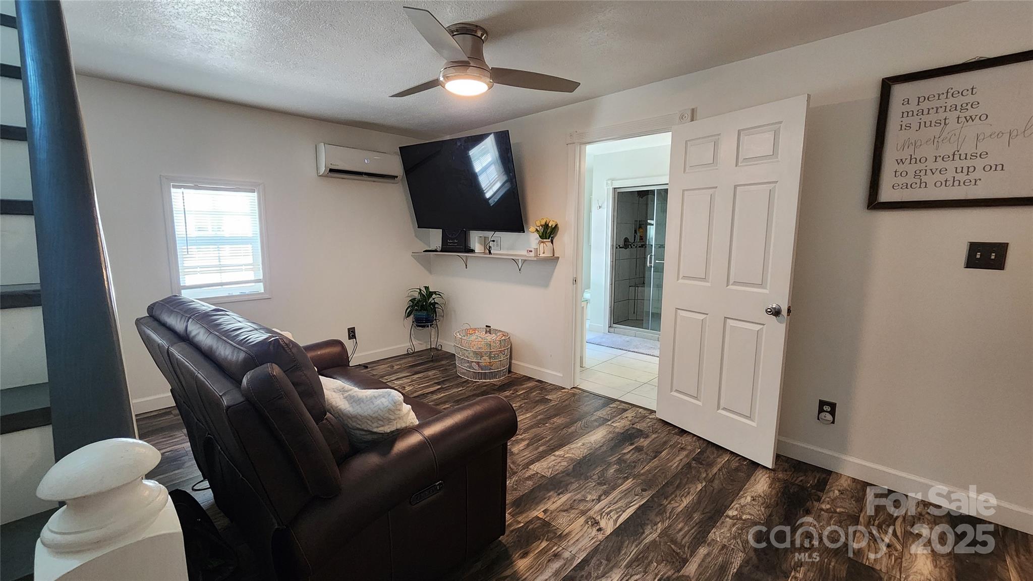 1235 Sulphur Springs Road Waynesville, NC 28786 - Photo 9 of 40 a living room with furniture and a flat screen tv