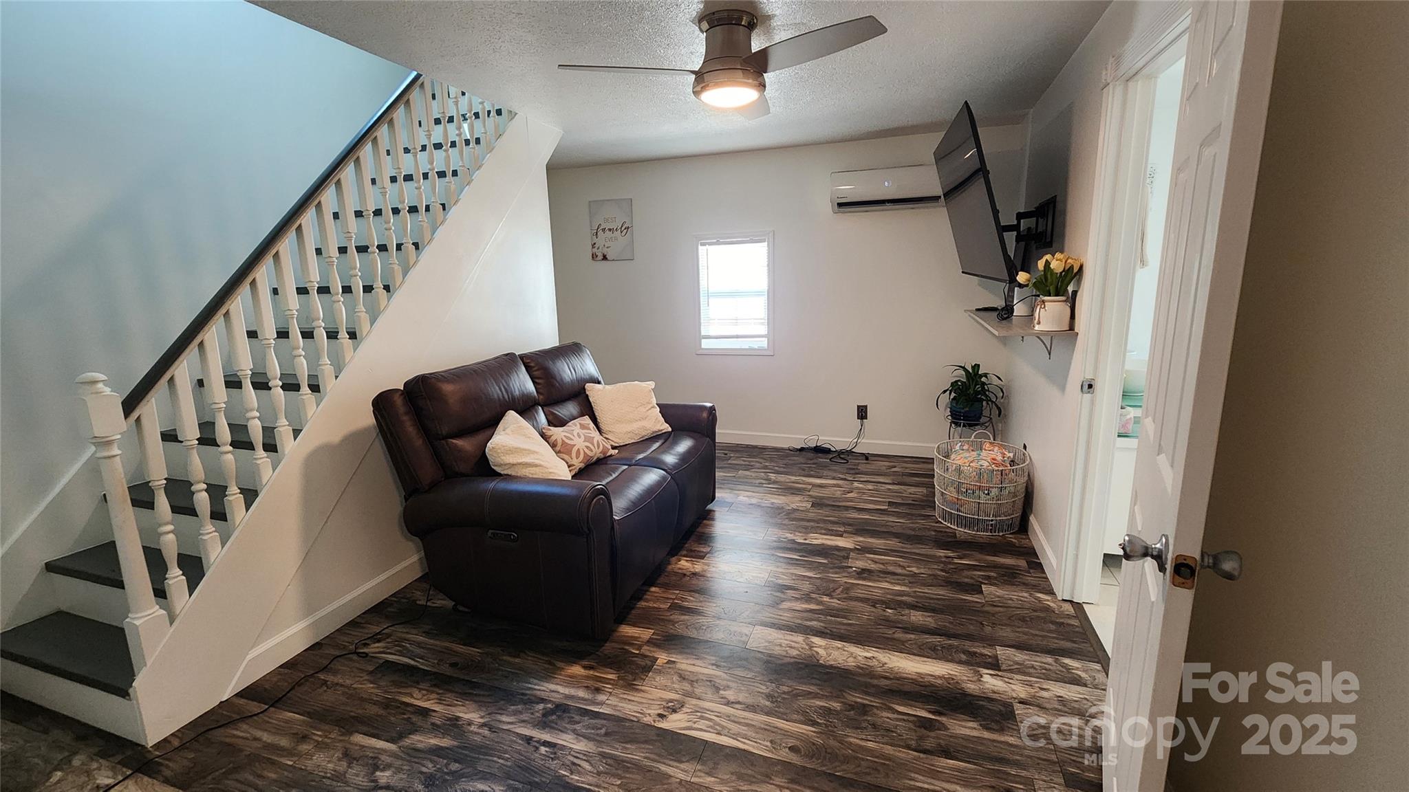 1235 Sulphur Springs Road Waynesville, NC 28786 - Photo 10 of 40 a living room with furniture or stairs and a wooden floor