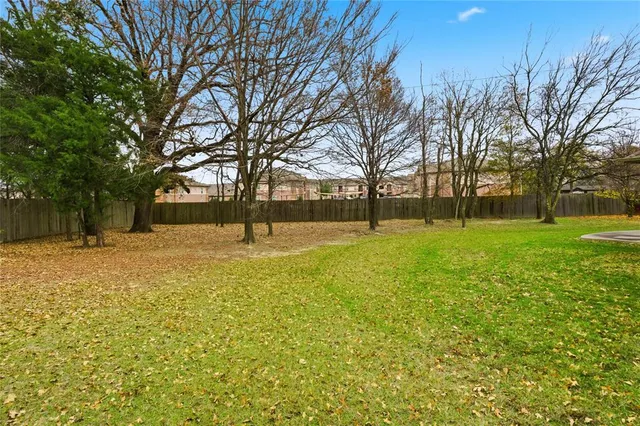 a swimming pool with outdoor seating and yard