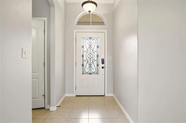 a view of a hallway to rooms