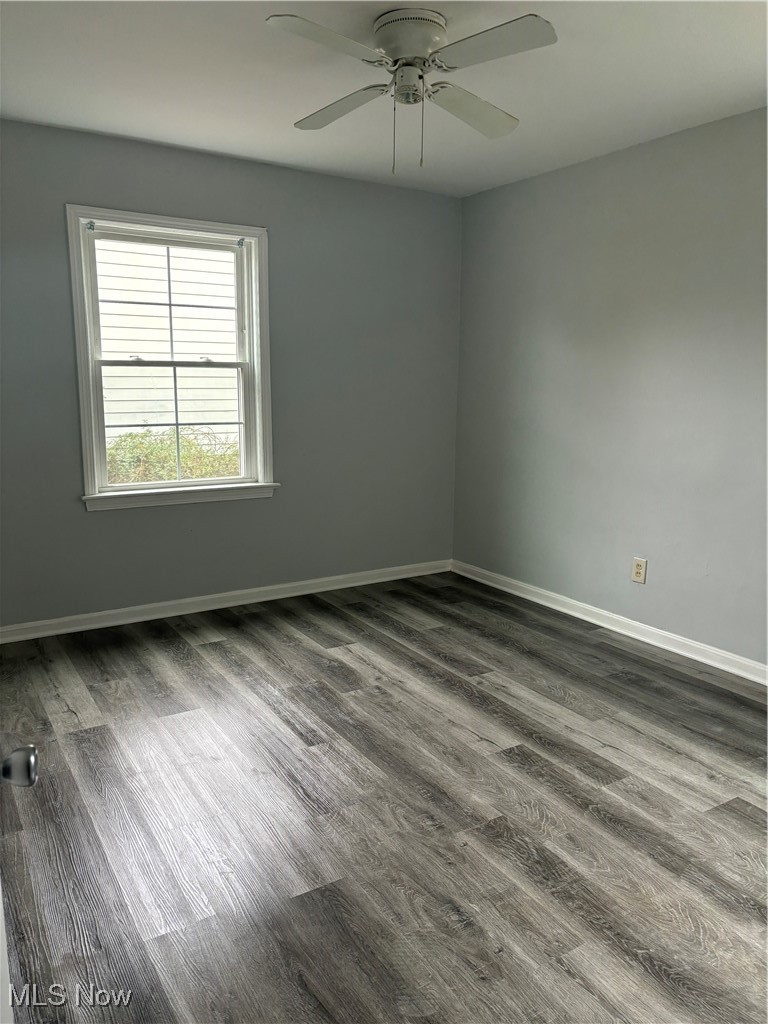 2525 Noble Road, Unit C3 Cleveland Heights, OH 44121 - Photo 9 of 11 Empty room with dark hardwood / wood-style floors and ceiling fan