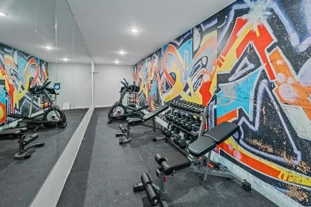 a room with gym equipment and a large window
