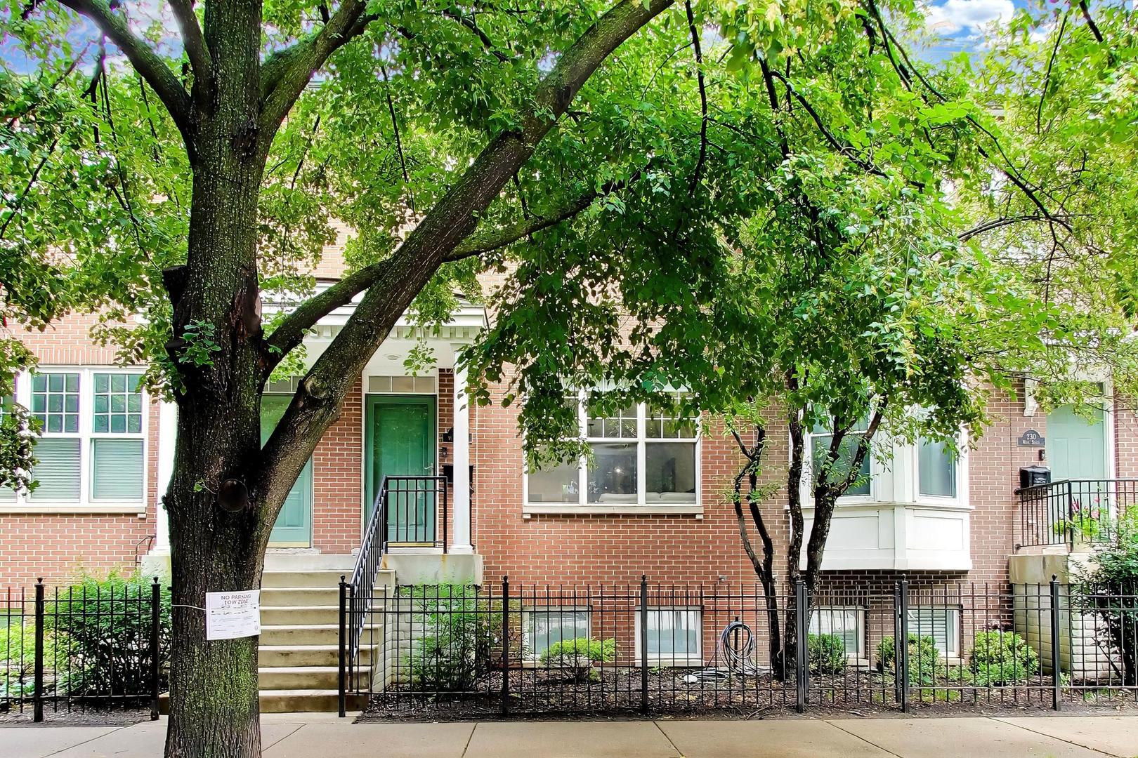 232 West Scott Street Chicago, IL 60610 - Photo 1 of 39 a front view of a house with a yard