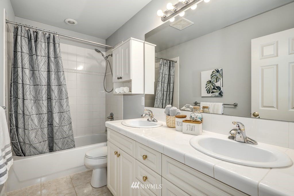 3620 209th Place Southeast Bothell, WA 98021 - Photo 21 of 31 a bathroom with a sink vanity mirror and toilet