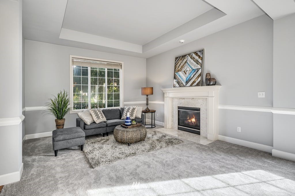 3620 209th Place Southeast Bothell, WA 98021 - Photo 4 of 31 a living room with furniture and a fireplace