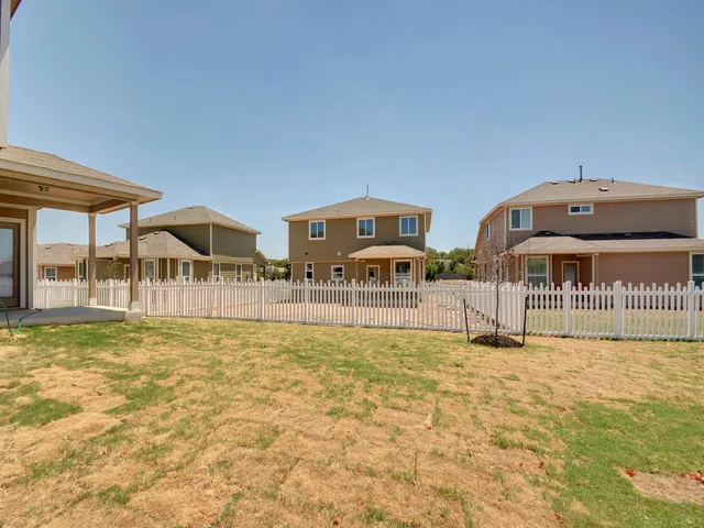 a view of swimming pool with outdoor seating and yard