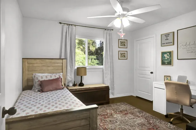 a bedroom with furniture and a window