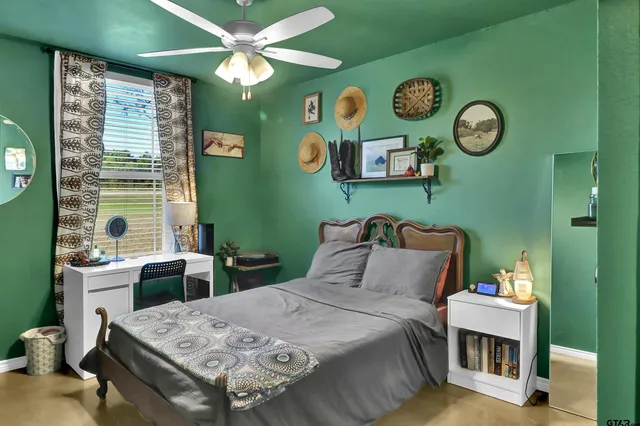 a bedroom with a bed and a table in it