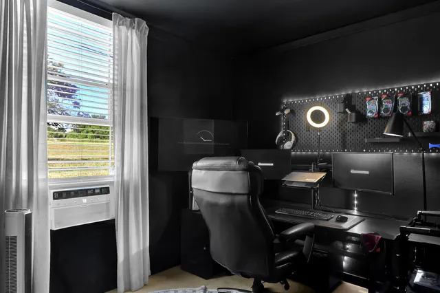 a room with furniture and air hockey table