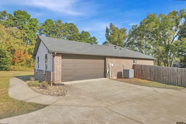 a front view of a house with a garage