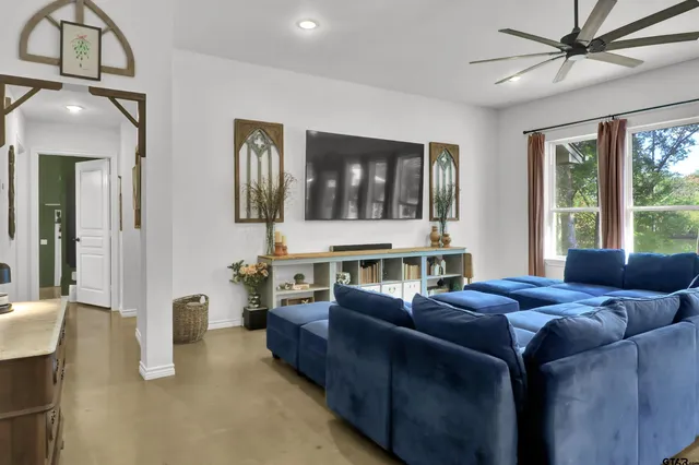 a living room with furniture and window