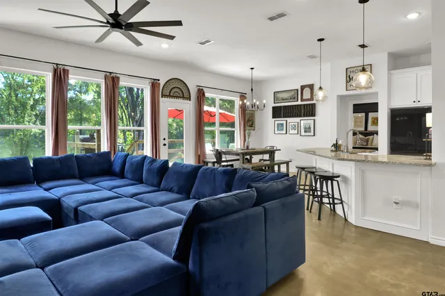 a living room with furniture and a large window