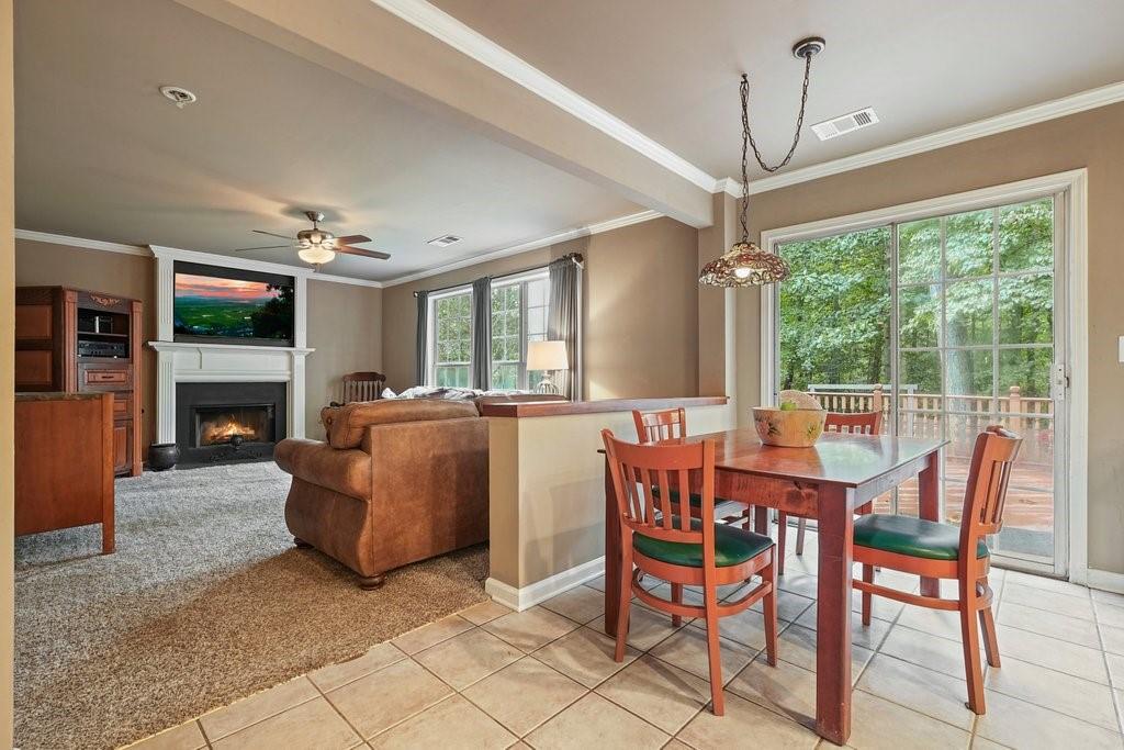 7335 Lytham Trace Cumming, GA 30041 - Photo 13 of 45 a view of a dining room with furniture window and wooden floor