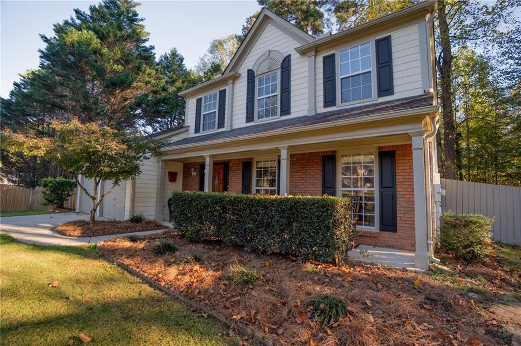 7335 Lytham Trace Cumming, GA 30041 - Photo 3 of 45 a front view of a house with a yard