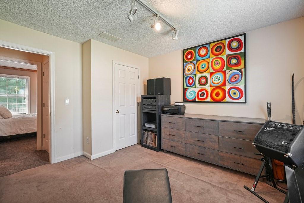 7335 Lytham Trace Cumming, GA 30041 - Photo 31 of 45 a view of a workspace with furniture and a window