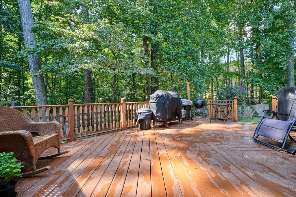 7335 Lytham Trace Cumming, GA 30041 - Photo 36 of 45 a view of backyard with a deck and wooden floor