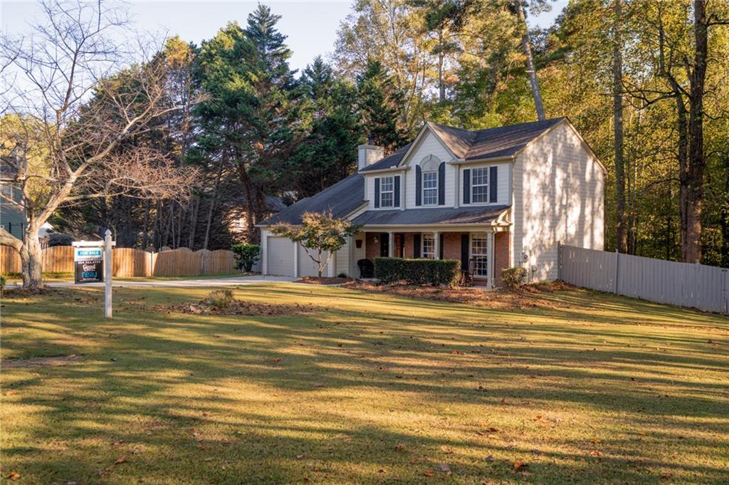7335 Lytham Trace Cumming, GA 30041 - Photo 37 of 45 a front view of a house with a ocean view