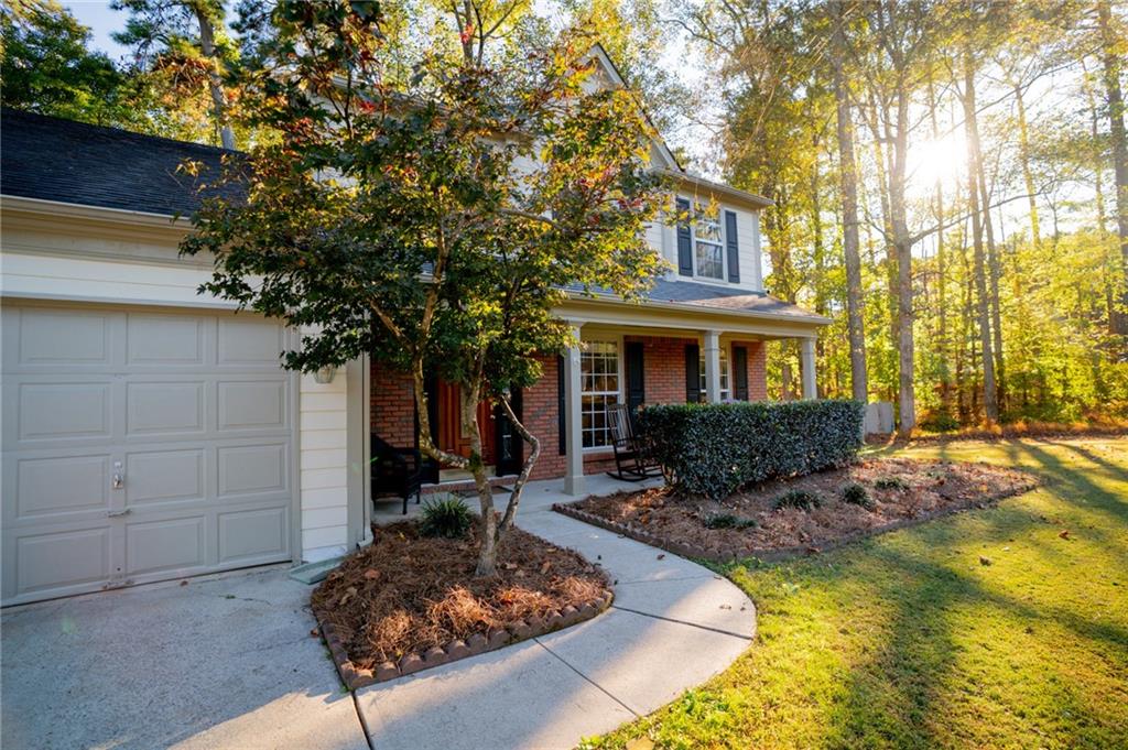 7335 Lytham Trace Cumming, GA 30041 - Photo 4 of 45 a front view of a house with garden