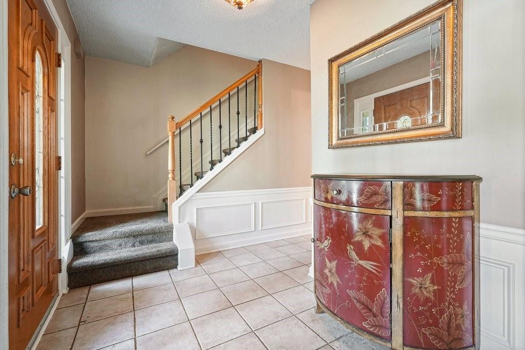 7335 Lytham Trace Cumming, GA 30041 - Photo 5 of 45 a view of an entryway with staircase