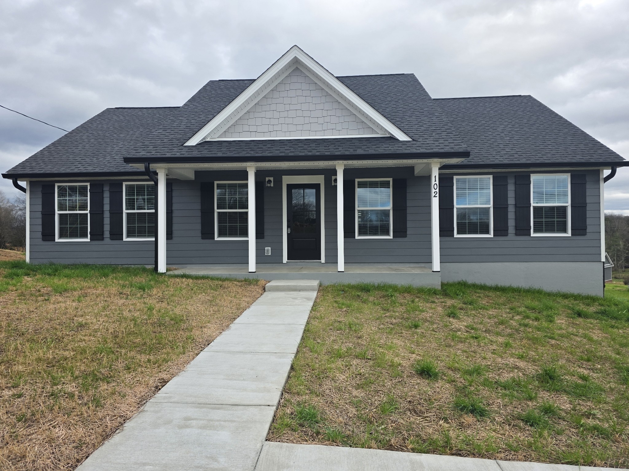 front view of a house with a yard