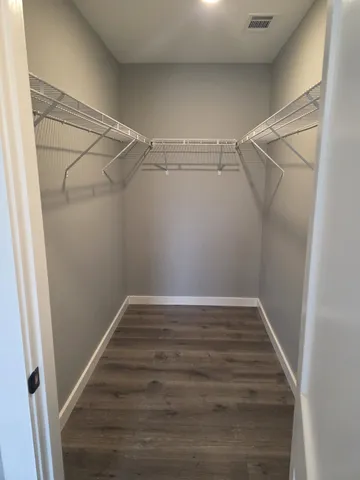 a view of an empty walk in closet