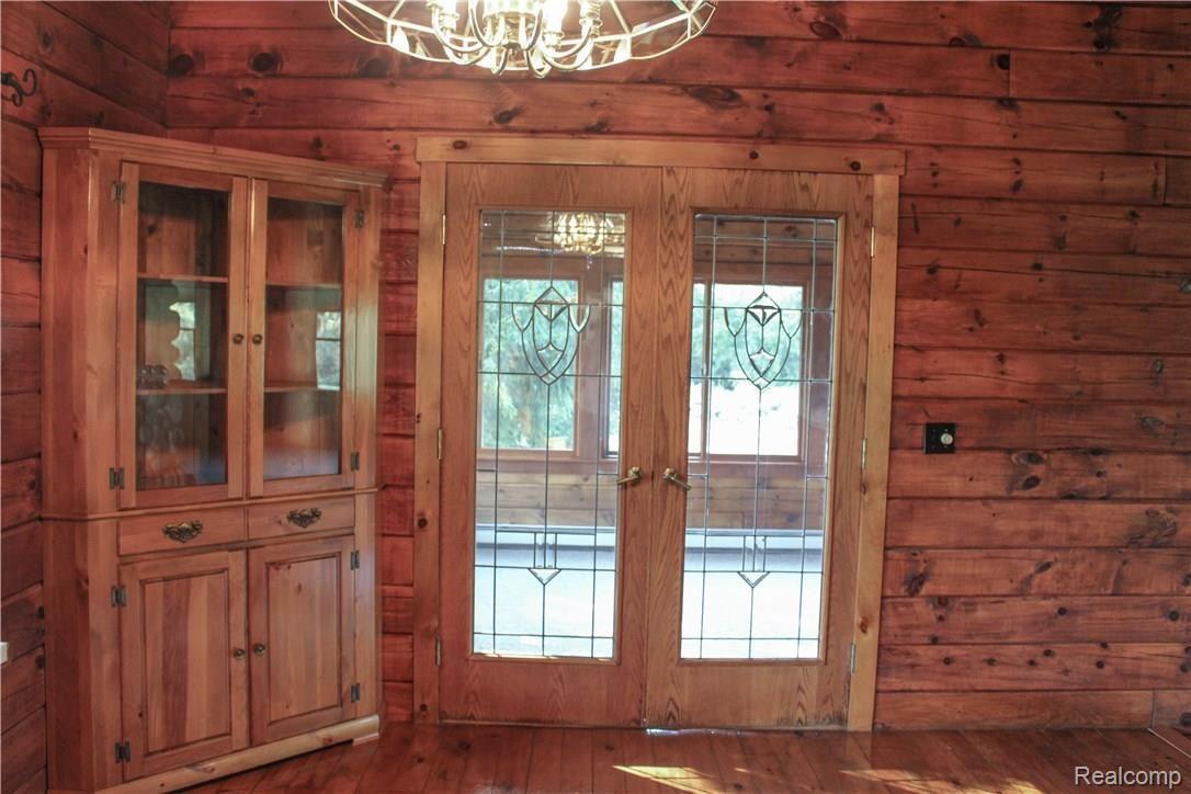 4165 Morgan Road Lake Orion, MI 48359 - Photo 44 of 81 Dining area built in china cabinet. Double Entry Glass doors to the bonus all season sun room.