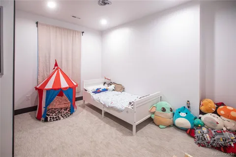 a patio with a table and chairs under an umbrella