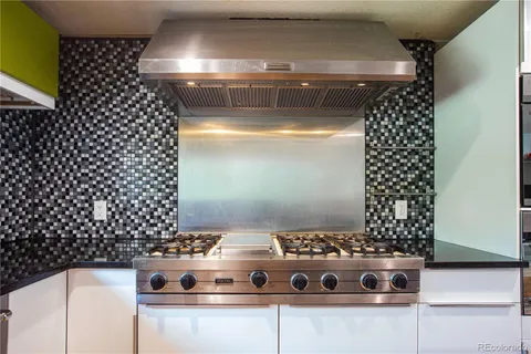 a bathroom with a double vanity sink toilet and a mirror