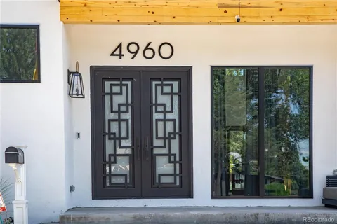 a living room with furniture fireplace and flat screen tv
