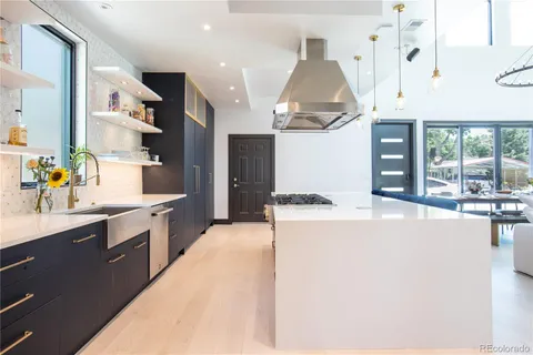 a kitchen with stainless steel appliances a sink a stove and a microwave