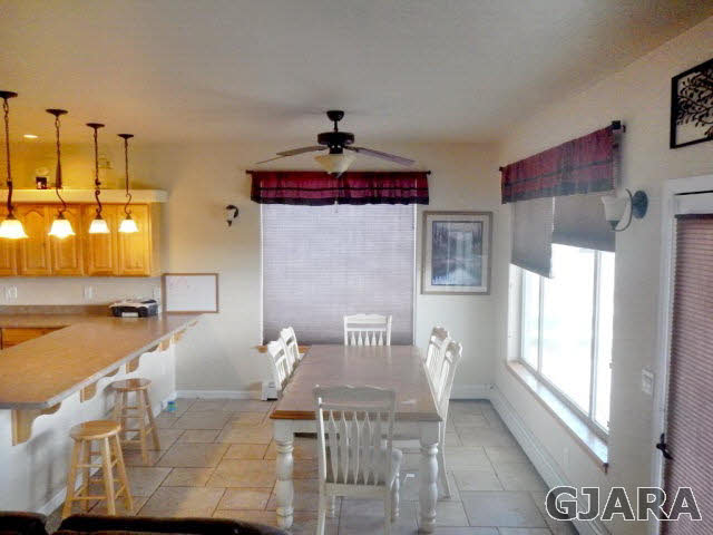 1454 19 Road Fruita, CO 81521 - Photo 3 of 9 a view of a dining room with furniture and a window