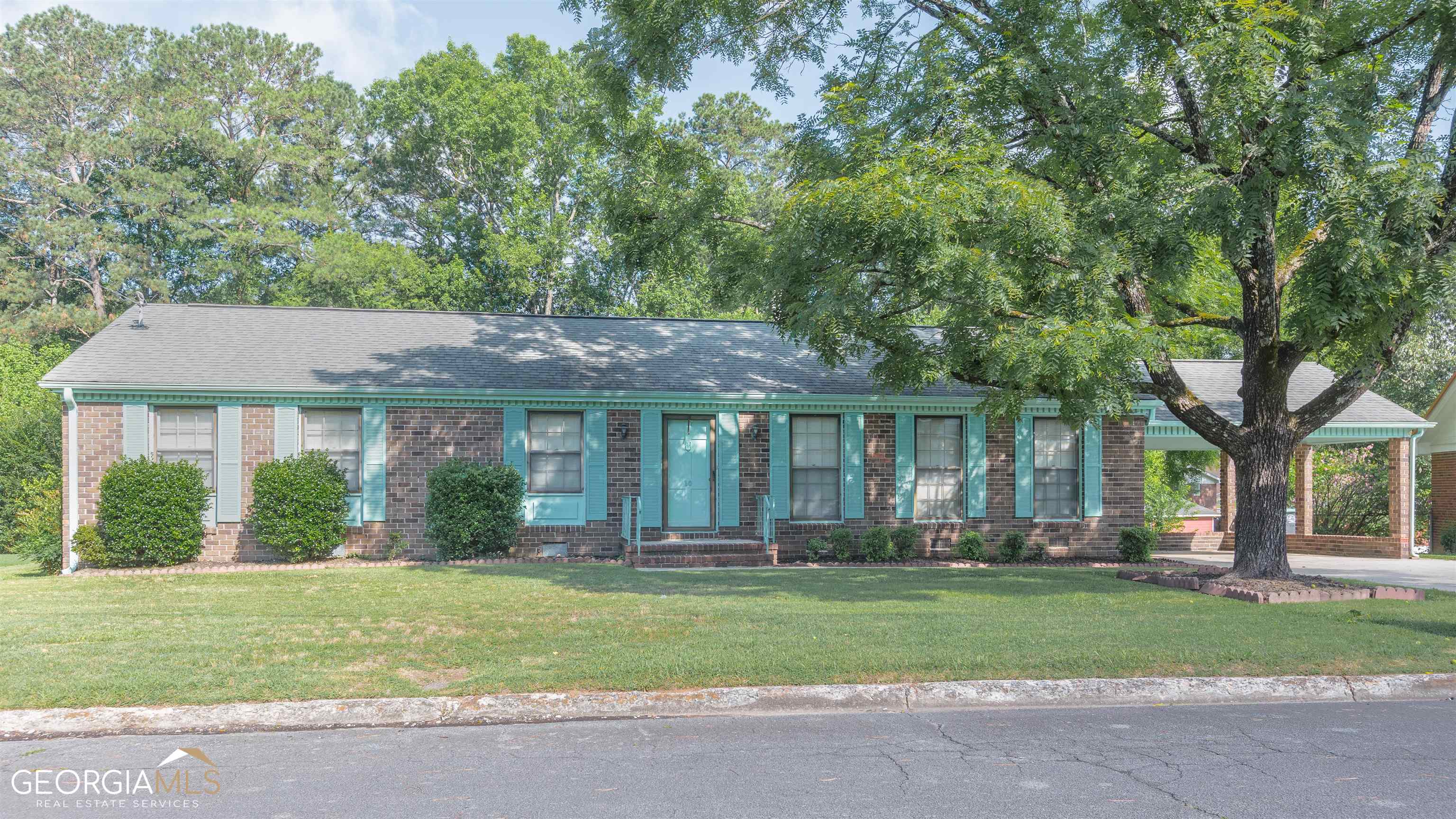 front view of a house with a yard