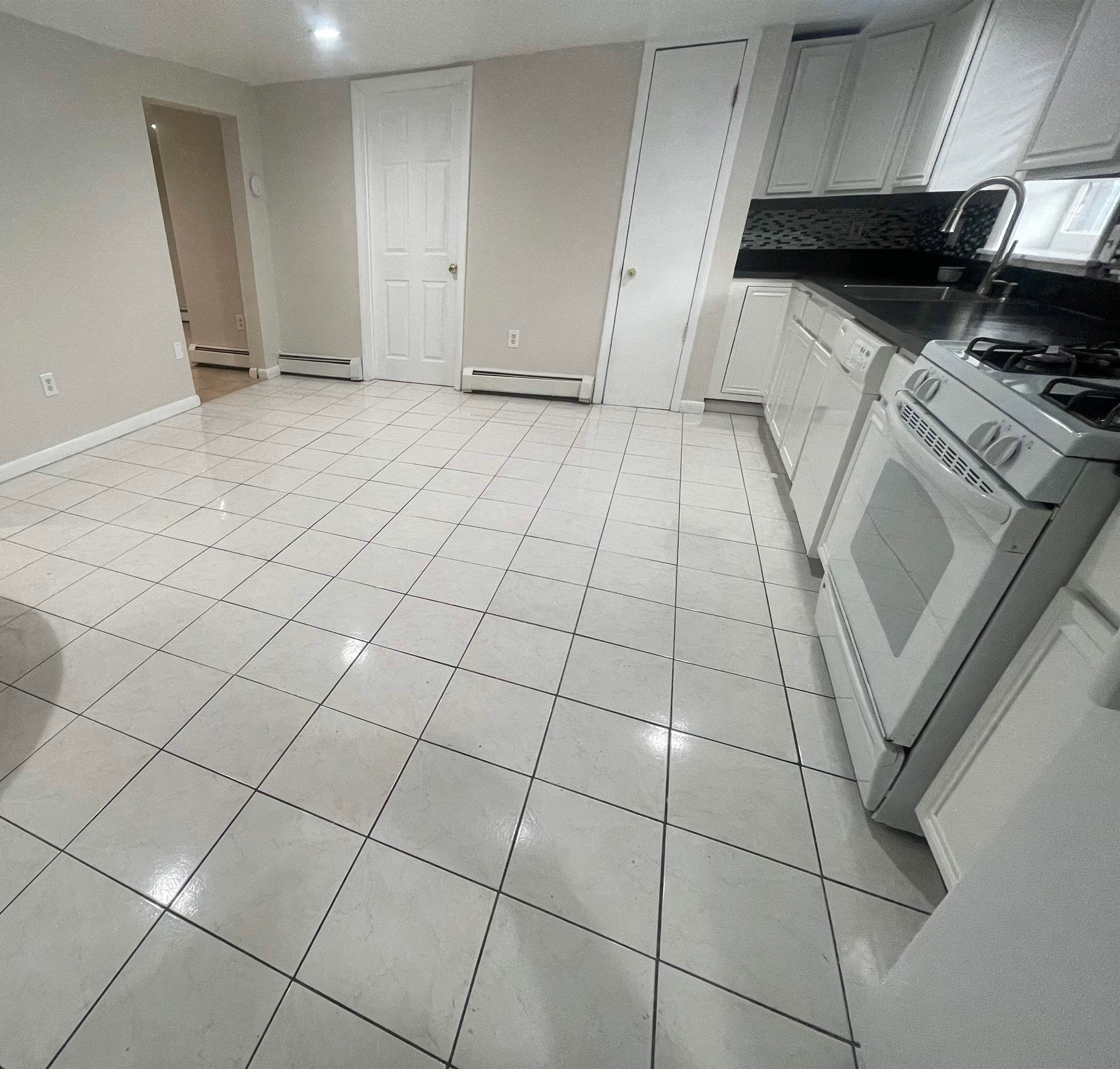 171 Charles Street, Unit 2 Secaucus, NJ 07094 - Photo 4 of 11 a view of a kitchen with the sink