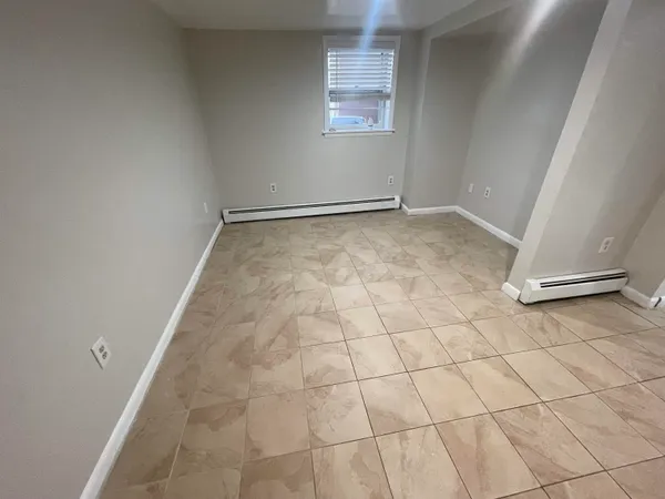 a view of an empty room and a window