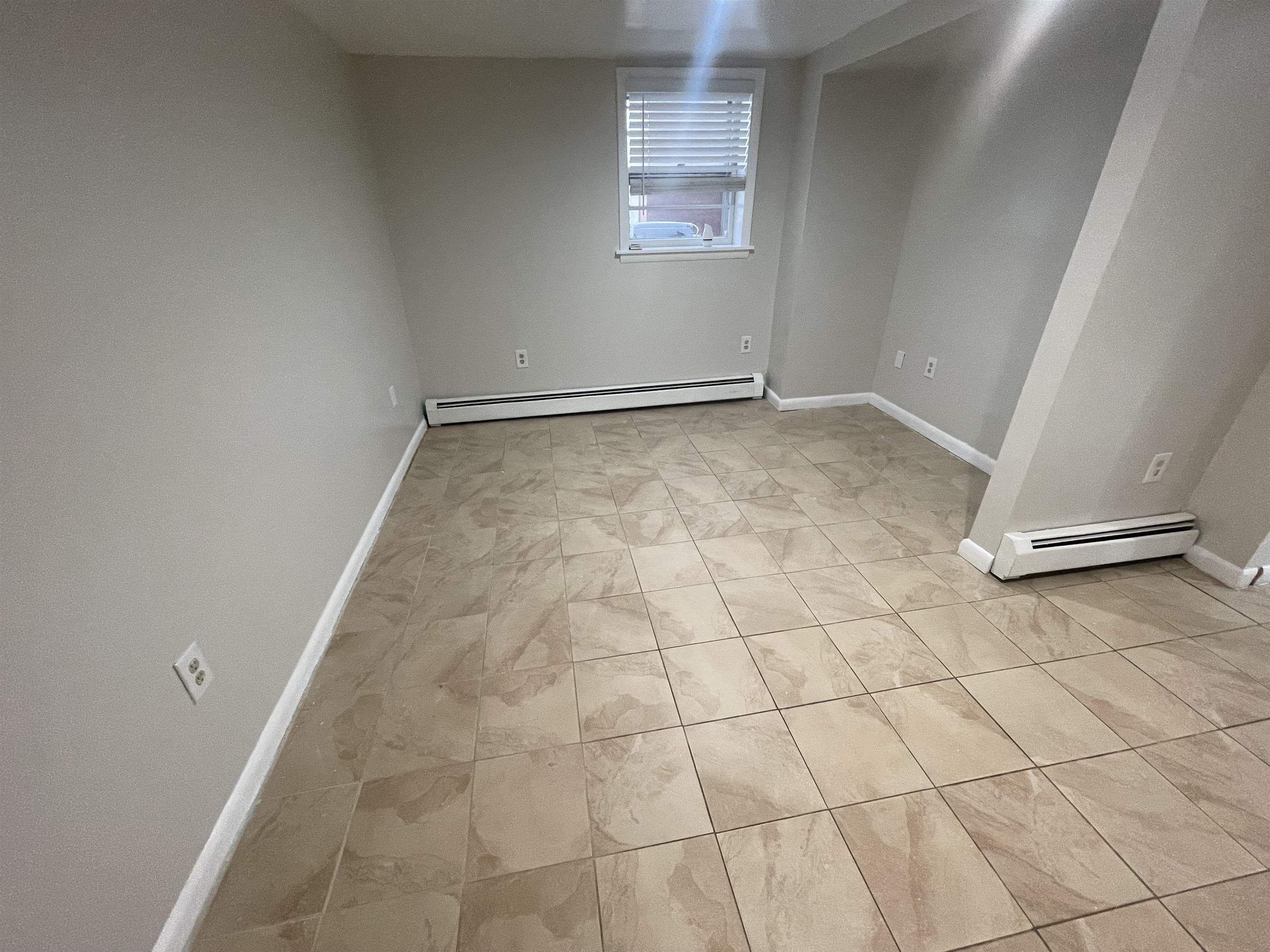 171 Charles Street, Unit 2 Secaucus, NJ 07094 - Photo 6 of 11 a view of an empty room and a window