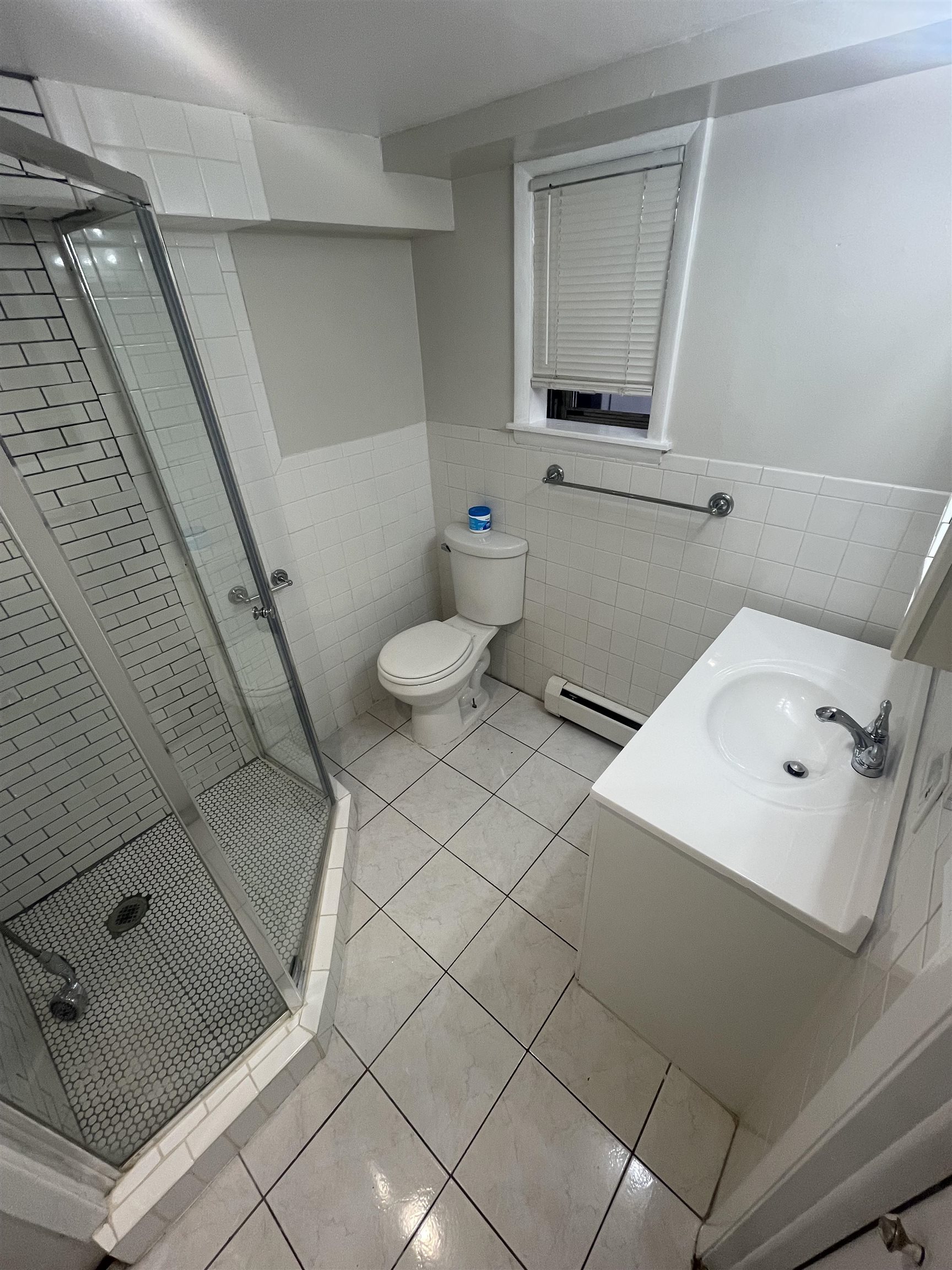 171 Charles Street, Unit 2 Secaucus, NJ 07094 - Photo 9 of 11 a bathroom with a sink and a mirror