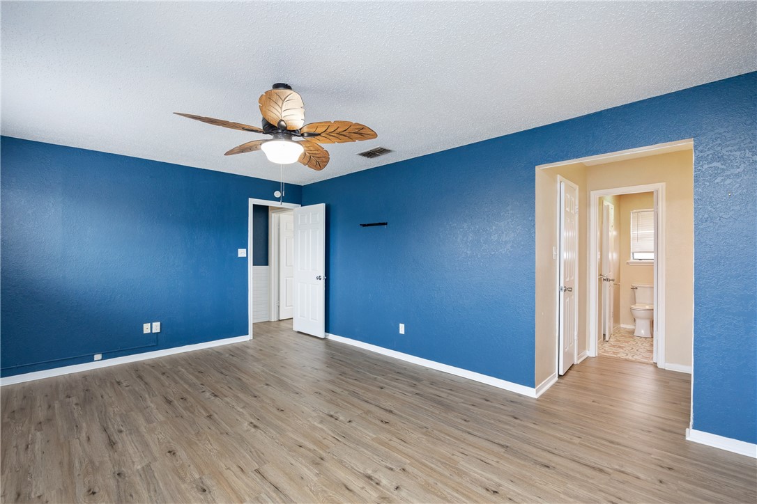 3052 Quail Springs Road, Unit A2 Corpus Christi, TX 78414 - Photo 17 of 31 a view of room with wooden floor