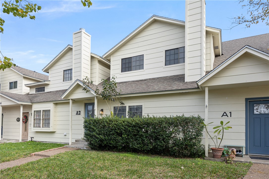 3052 Quail Springs Road, Unit A2 Corpus Christi, TX 78414 - Photo 2 of 31 a front view of a house with a garden