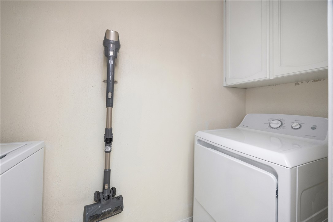 3052 Quail Springs Road, Unit A2 Corpus Christi, TX 78414 - Photo 26 of 31 a utility room with dryer and washer