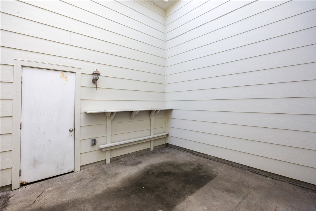 3052 Quail Springs Road, Unit A2 Corpus Christi, TX 78414 - Photo 27 of 31 a room with a bench and dryer