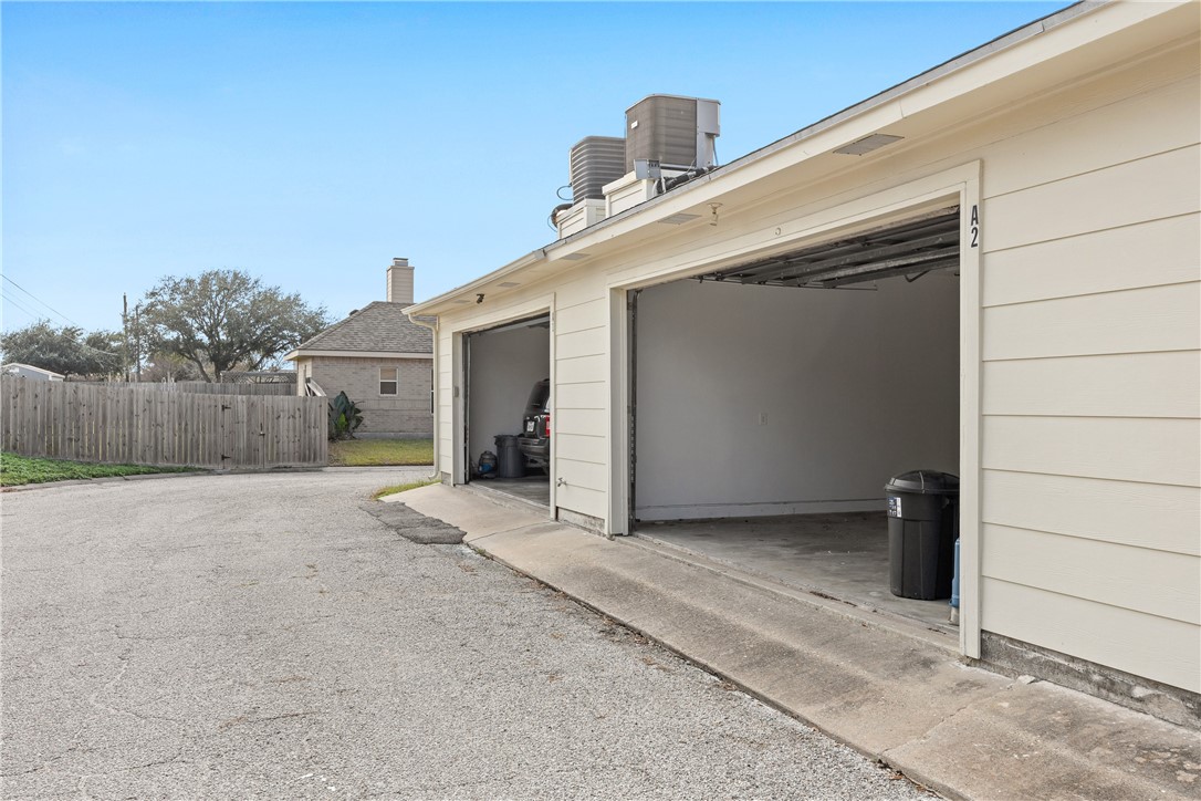 3052 Quail Springs Road, Unit A2 Corpus Christi, TX 78414 - Photo 30 of 31 a view of a house with backyard and parking space